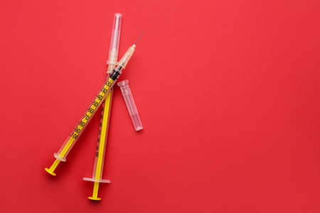 Syringes for insulin injection on color background. Diabetes conceptの写真素材