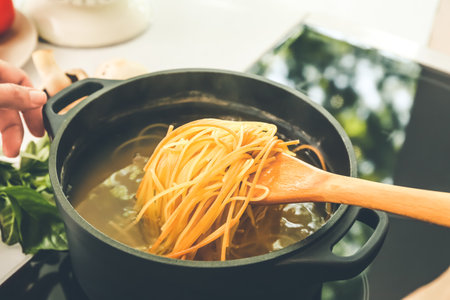 Pasta boiling in cooking potの写真素材