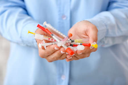 Woman with syringes for insulin injection, closeup. Diabetes conceptの写真素材