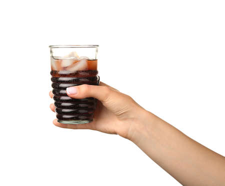 Hand with glass of tasty cola on white background