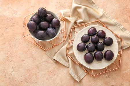 Composition with ripe plums on tableの写真素材