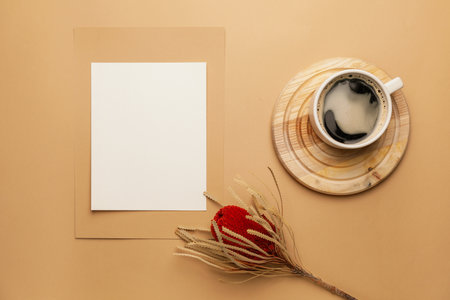 Composition with blank card and cup of coffee on color backgroundの写真素材
