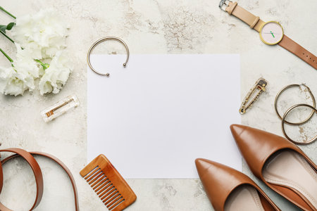 Composition with blank card and female accessories on light backgroundの写真素材