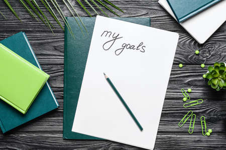 Text MY GOALS, pencil and notebooks on wooden backgroundの写真素材