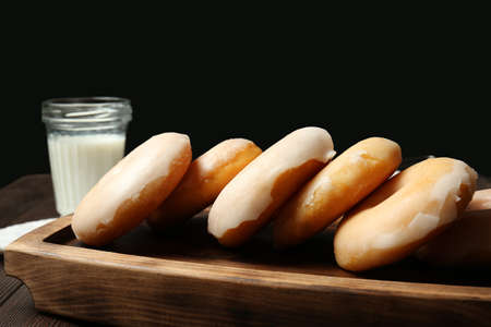 Tasty donuts on wooden tableの写真素材