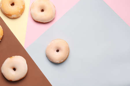 Tasty donuts on color backgroundの写真素材