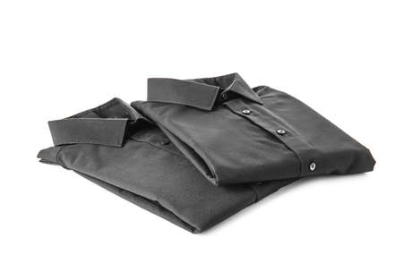 Folded male shirts on white backgroundの写真素材
