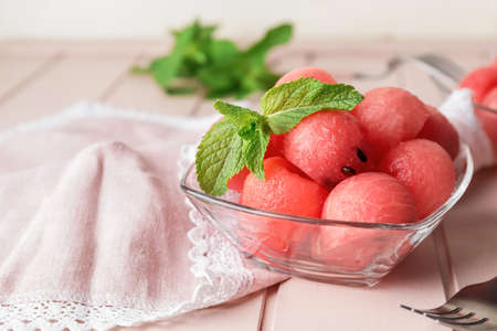 Tasty watermelon balls in bowl on tableの写真素材