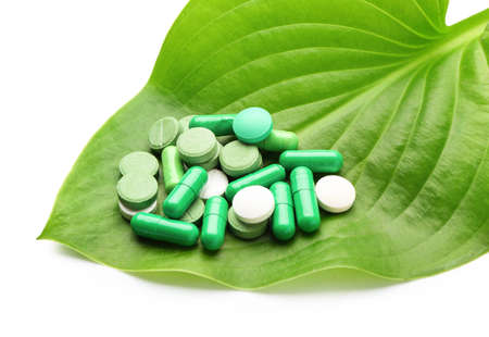 Plant based pills on white backgroundの写真素材