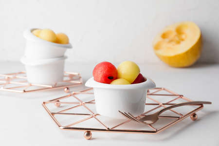 Tasty watermelon balls in bowls on tableの写真素材