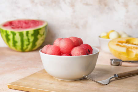 Tasty watermelon balls in bowl on tableの写真素材
