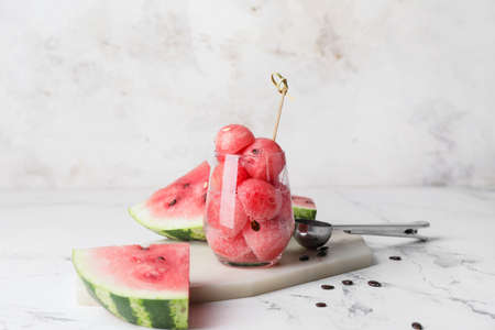 Tasty watermelon balls in glass on tableの写真素材