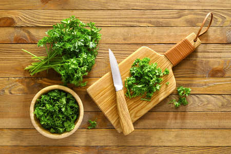 Composition with fresh parsley on wooden backgroundの写真素材