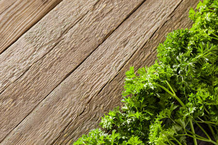Fresh parsley on wooden background