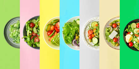 Plates with different healthy salads on color backgroundの写真素材