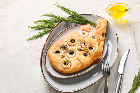 Plate with traditional Italian focaccia on light backgroundの写真素材