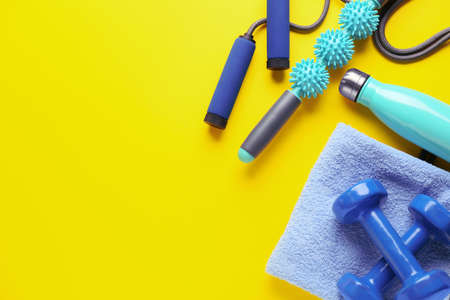 Sports equipment with body roller on color background