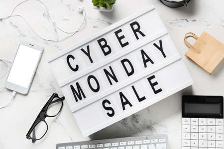 Board with text CYBER MONDAY SALE on white background