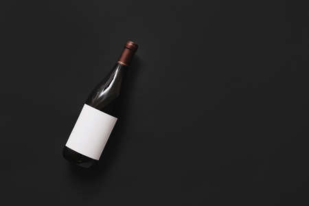 Bottle of wine with blank label on dark backgroundの写真素材