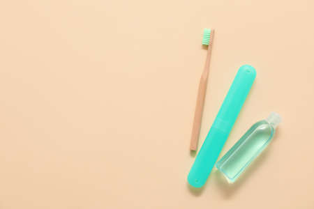 Toothbrush, case and mouth rinse on color backgroundの写真素材