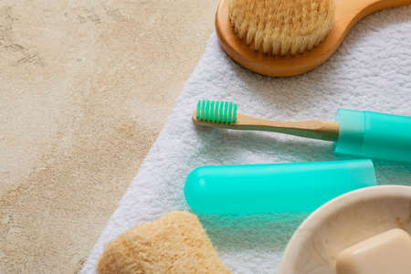 Set of bath accessories with toothbrush and case on color backgroundの写真素材