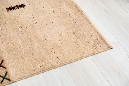 Beautiful soft carpet on wooden floor