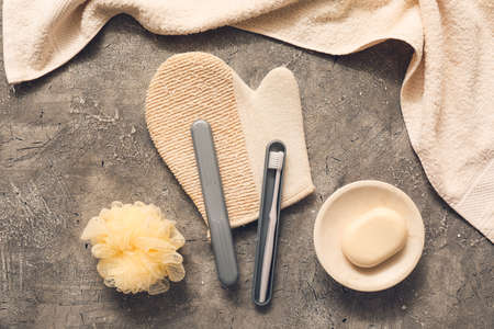 Set of bath accessories with toothbrush and case on gray backgroundの写真素材