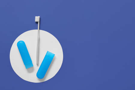 Toothbrush and case on color background