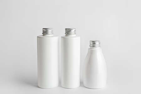 Different cosmetic products on light background