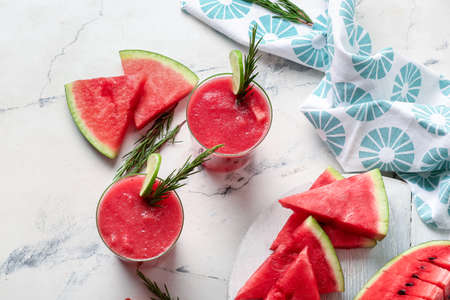 Glasses with fresh watermelon juice on light backgroundの写真素材