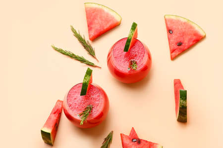 Glasses with fresh watermelon juice on color backgroundの写真素材