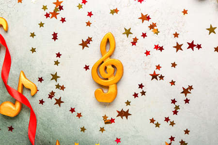 Music note with Christmas decor on color backgroundの写真素材