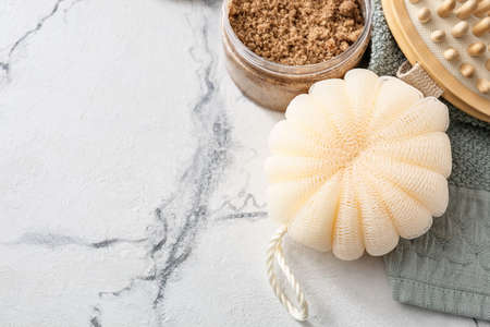 Bath sponge and natural cosmetics on light backgroundの写真素材