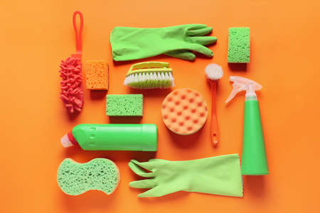 Set of cleaning supplies on color backgroundの写真素材