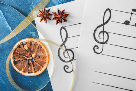 Composition with note sheets and Christmas decor on tableの写真素材