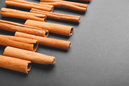 Cinnamon sticks on gray backgroundの写真素材