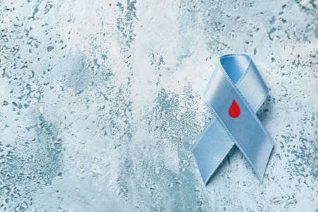 Awareness ribbon on color background. Diabetes concept