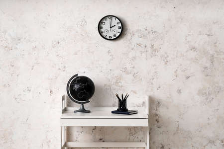 Comfortable workplace near light wall in roomの写真素材