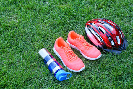 Set of sport equipment on green grass