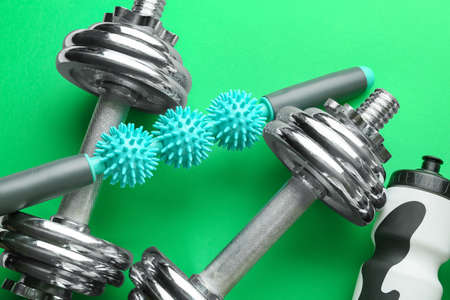 Set of sport equipment on color backgroundの写真素材