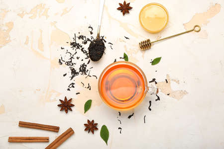 Cup of hot aromatic tea on light backgroundの写真素材