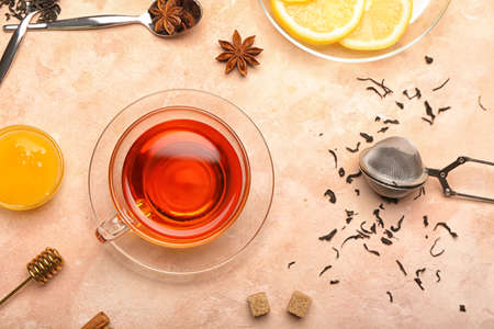 Composition with cup of hot aromatic tea on light backgroundの写真素材