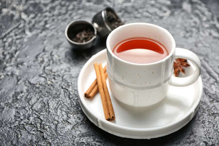 Cup of hot aromatic tea on dark backgroundの写真素材