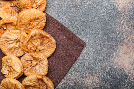 Tasty dried figs on grunge backgroundの写真素材