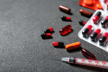 Syringe with drugs on dark backgroundの写真素材