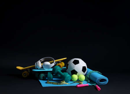 Set of sports equipment on dark backgroundの写真素材