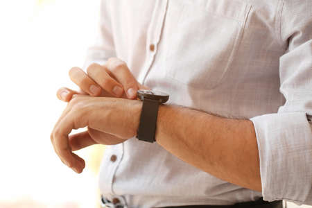 Young businessman with smart watch, closeup
