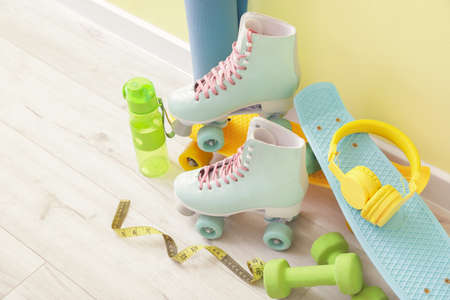 Set of different sports equipment on floorの写真素材