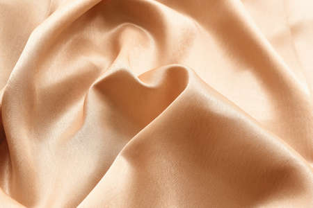 Golden fabric texture as backgroundの写真素材