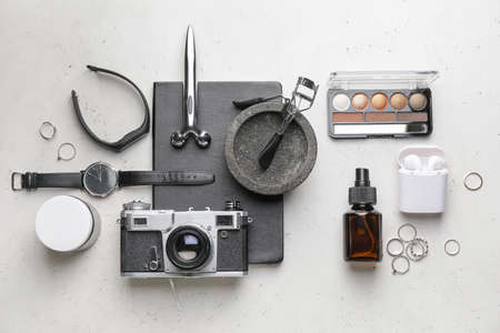 Stylish composition with wristwatch, gadgets and accessories on light backgroundの写真素材